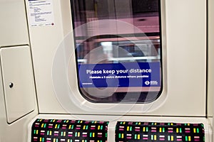 LONDON/ENGLAND- 2 June 2020: Poster on a London Underground tube train during the Coronavirus pandemic 2020